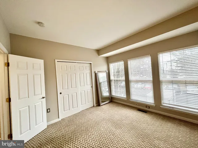 a view of a room with large windows