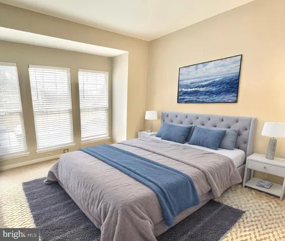 a bedroom with bed and window