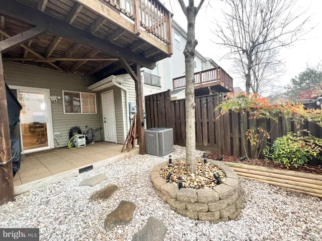 a view of a chair and table in the patio