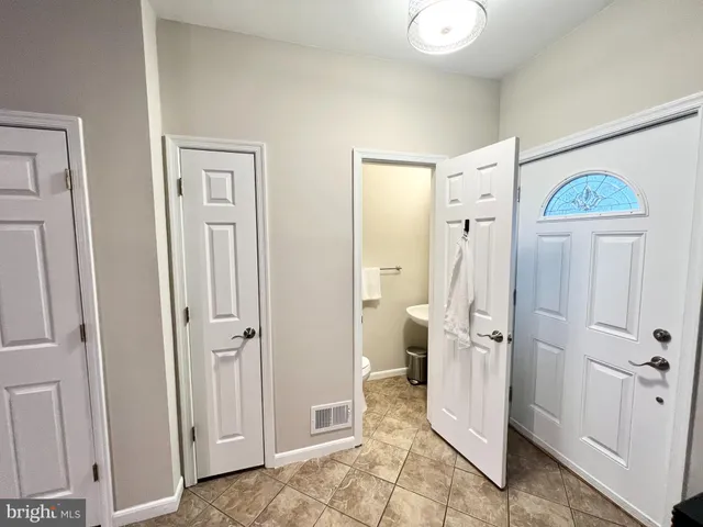 a view of a bathroom with a shower and a sink