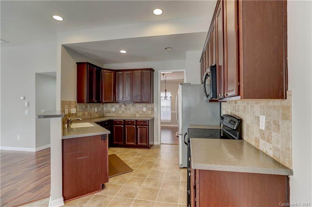 7207 Meyer Road Fort Mill, SC 29715 - Photo 14 of 48 a kitchen with a sink appliances and cabinets