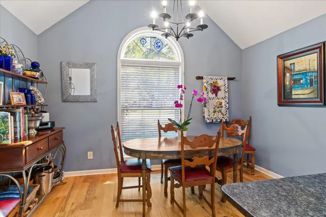 a bathroom with a granite countertop sink and a large mirror