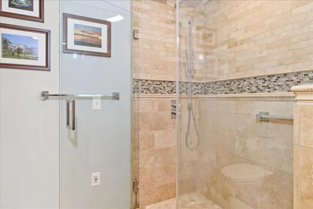 a living room filled with furniture and a flat screen tv