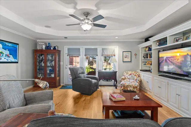 a kitchen with kitchen island granite countertop a sink a counter space appliances and cabinets