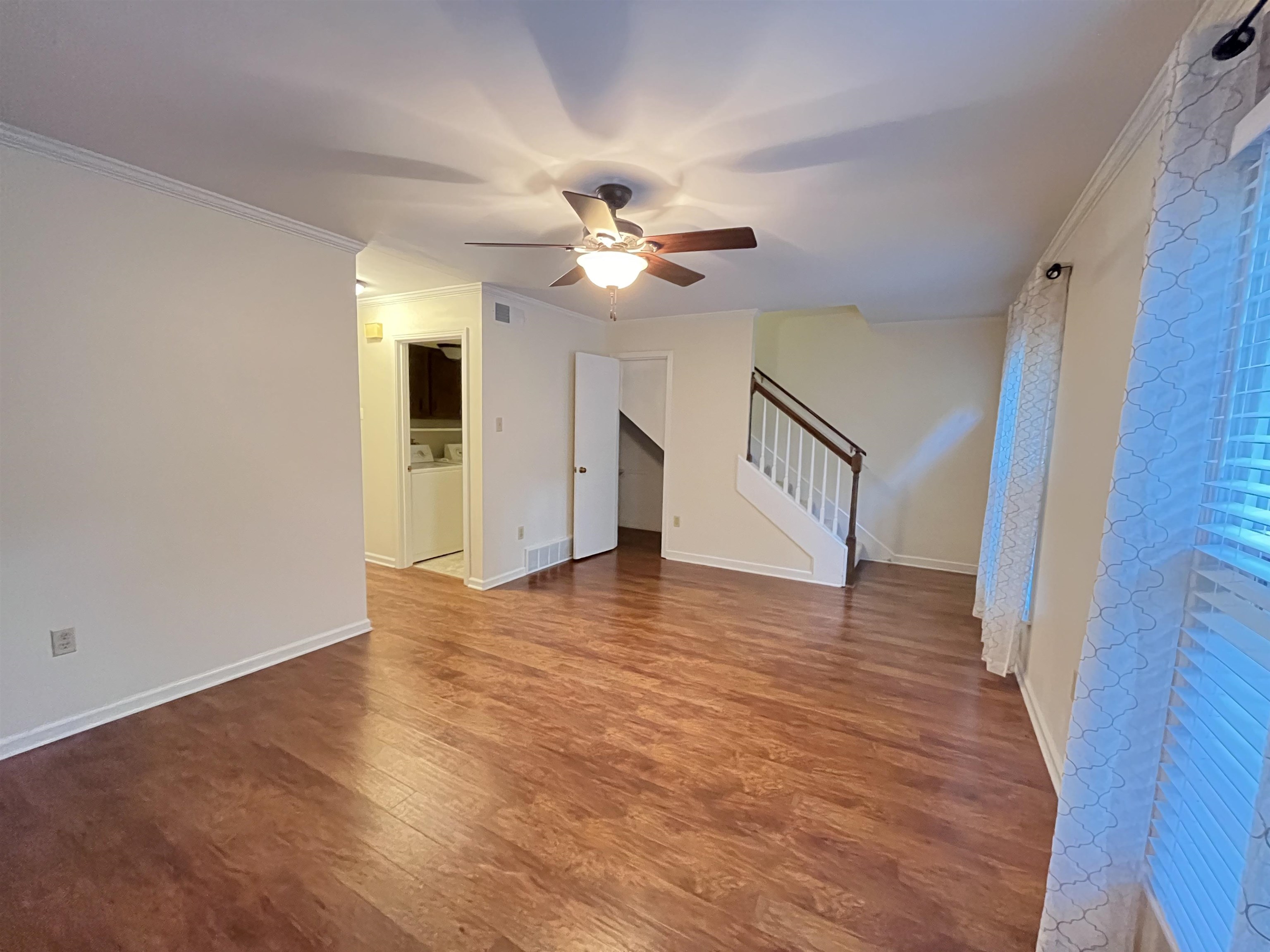 6960 Country Road Germantown, TN 38138 - Photo 1 of 36 a view of an empty room with window and a ceiling fan