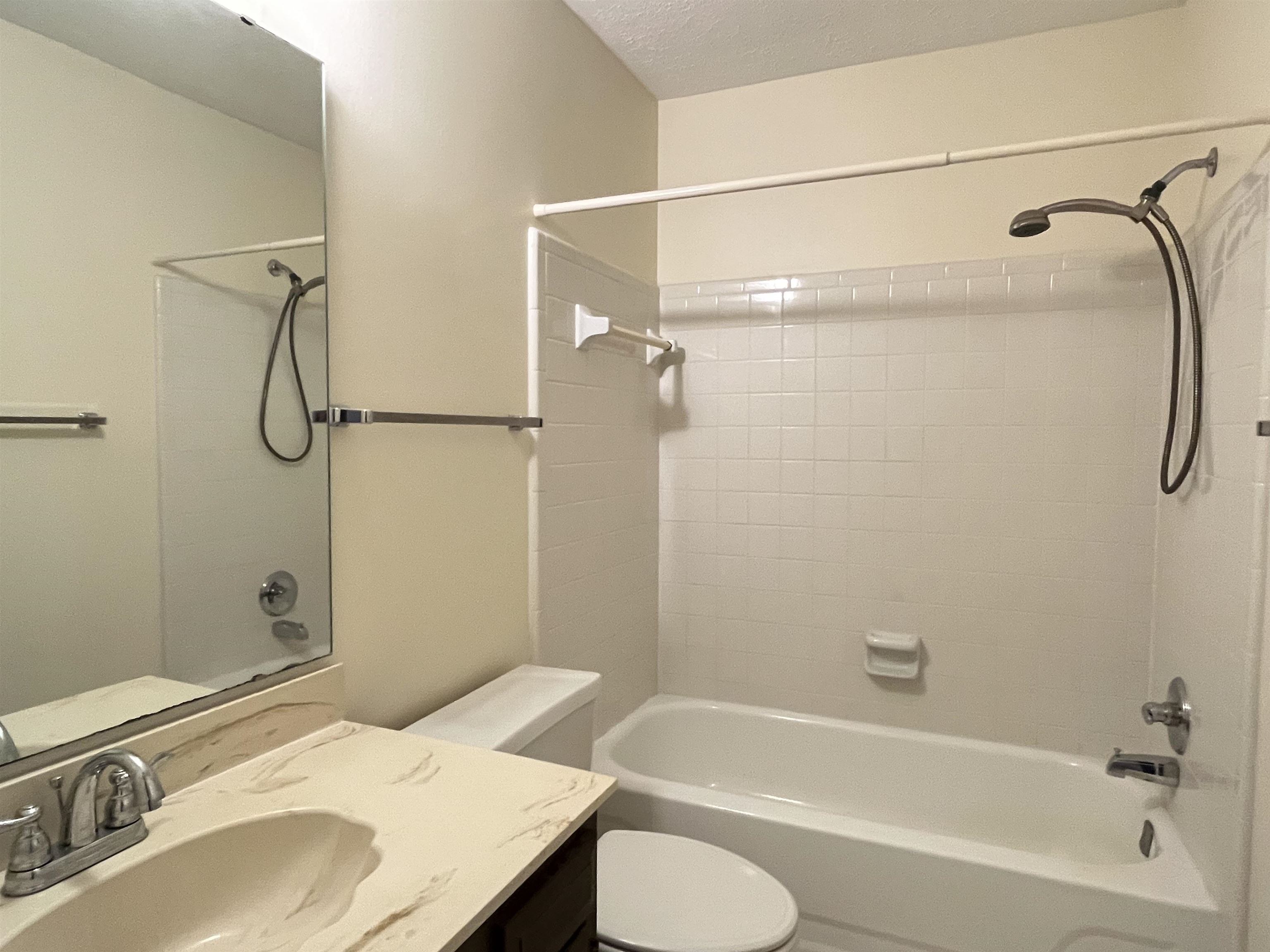 6960 Country Road Germantown, TN 38138 - Photo 26 of 36 a bathroom with a granite countertop sink toilet and shower