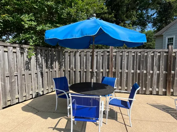 a view of a swimming pool with a yard