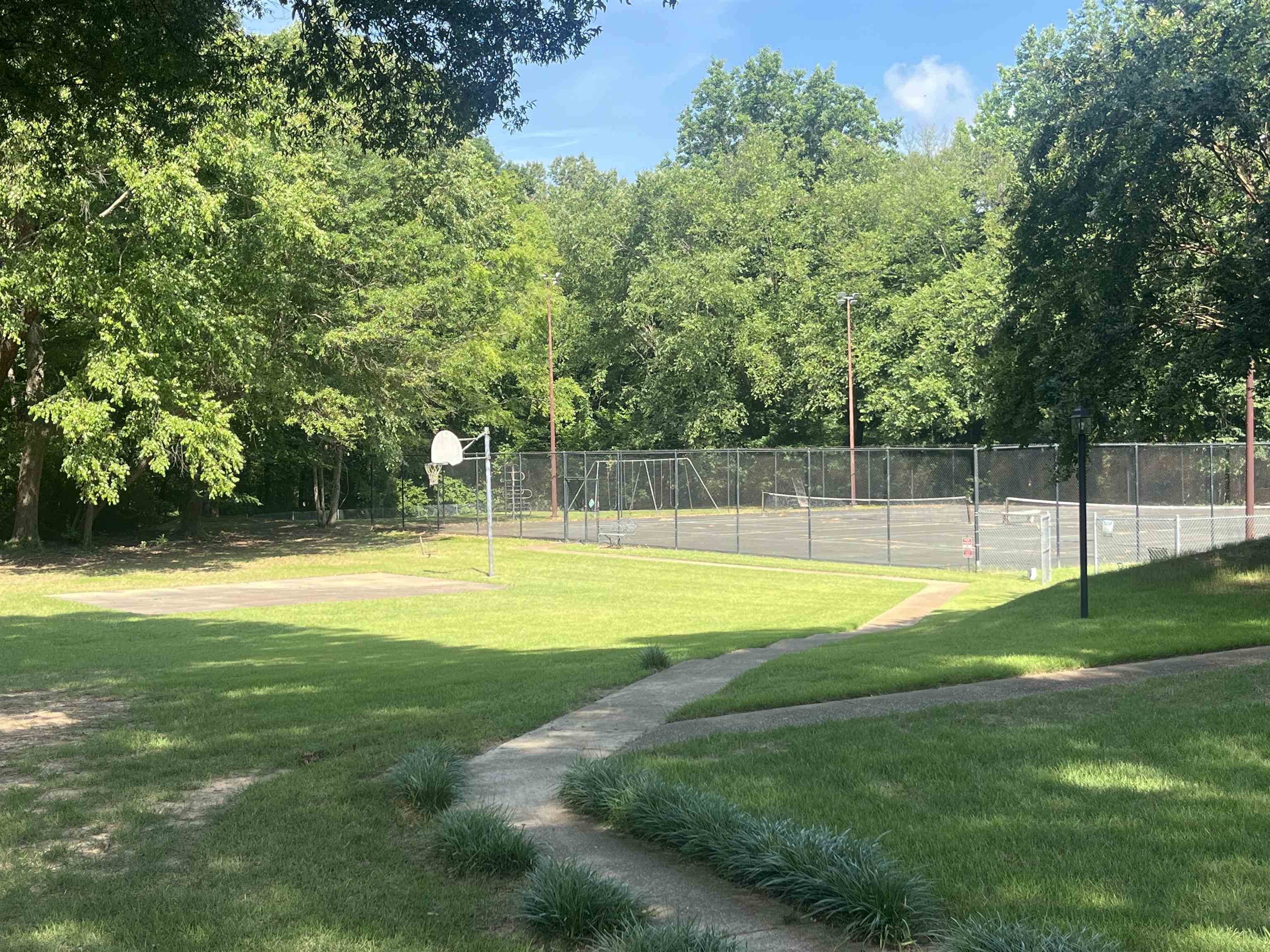 6960 Country Road Germantown, TN 38138 - Photo 30 of 36 a view of a swimming pool with a yard