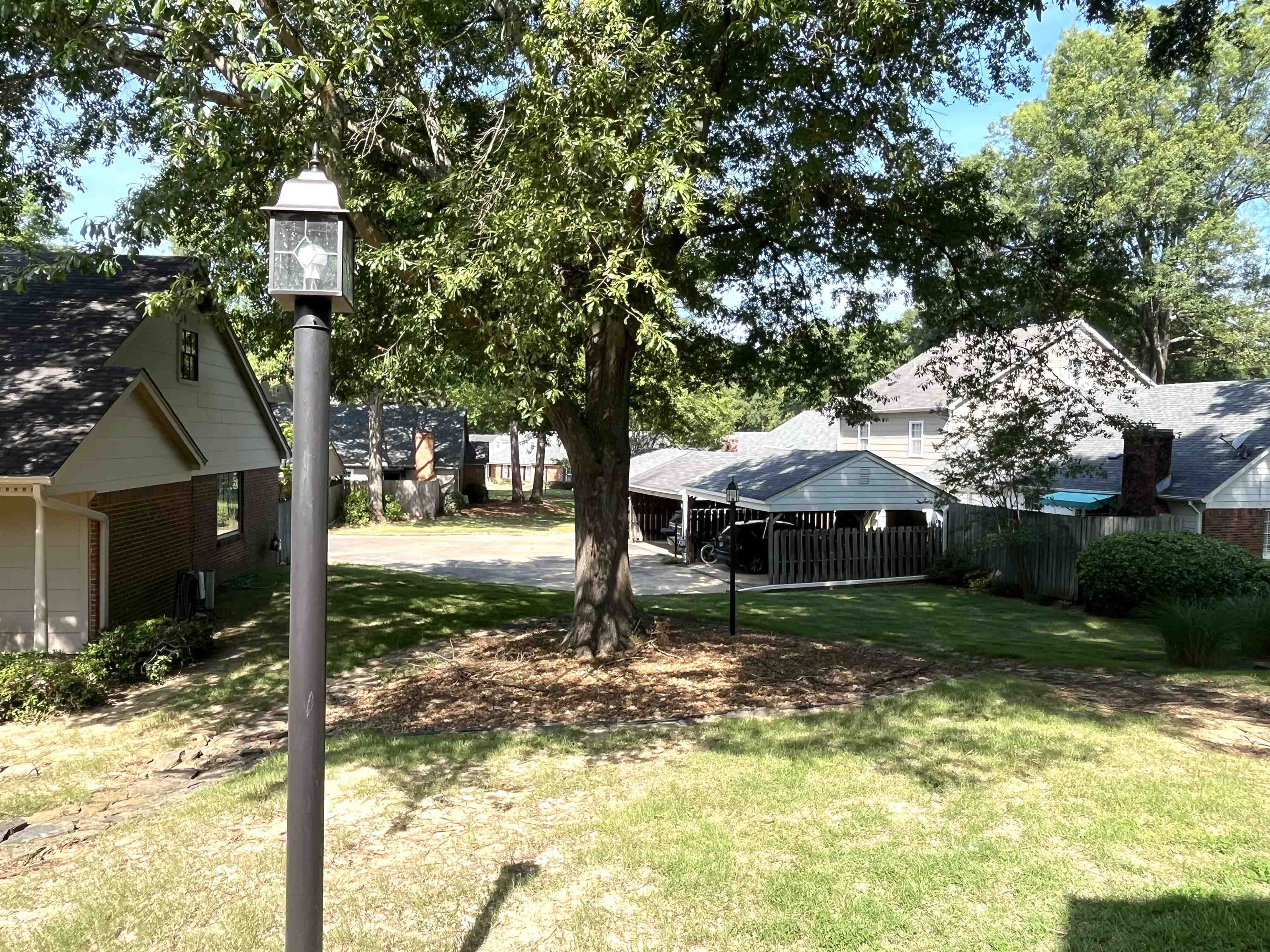 6960 Country Road Germantown, TN 38138 - Photo 3 of 36 a backyard of a house with yard and outdoor seating