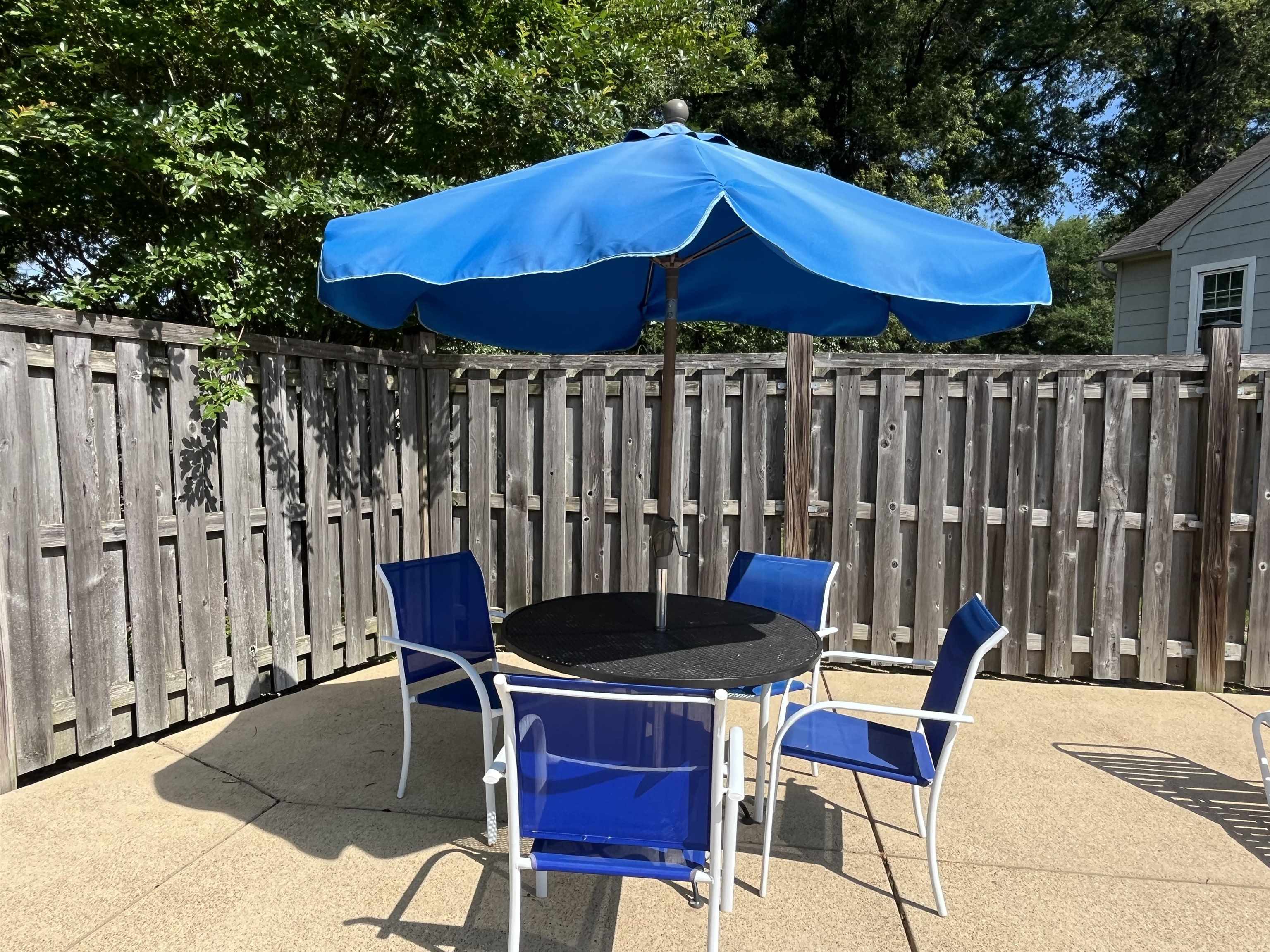 6960 Country Road Germantown, TN 38138 - Photo 7 of 36 a patio with wooden table and chairs