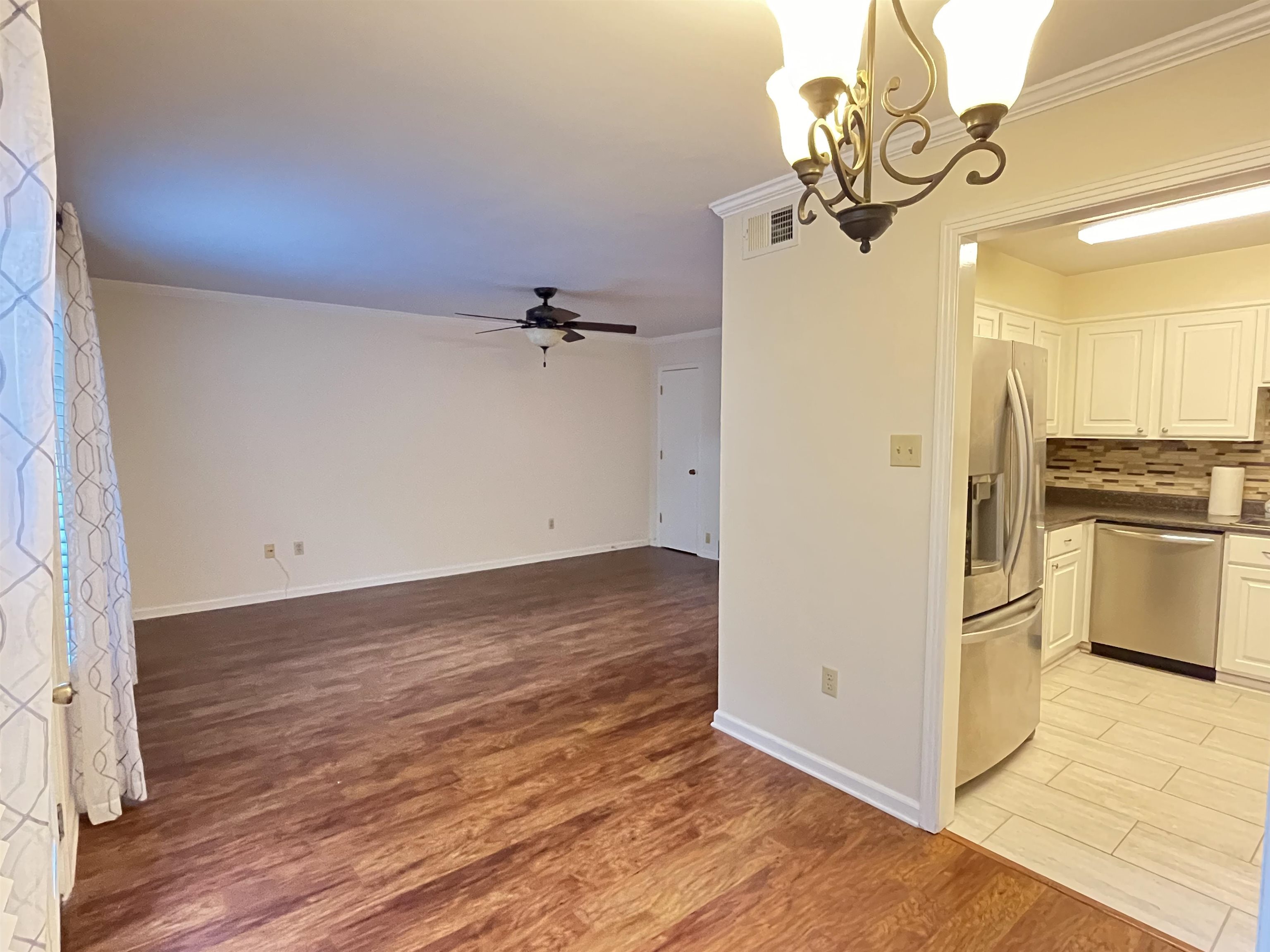 6960 Country Road Germantown, TN 38138 - Photo 10 of 36 a view of a storage & utility room with wooden floor