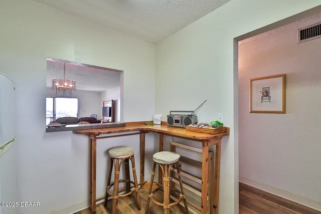 a kitchen with stainless steel appliances a stove a sink and a microwave
