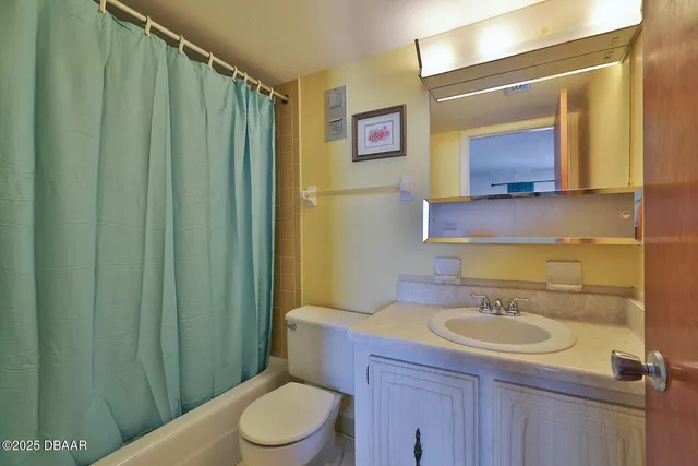 a bedroom with a bed and a lamp on table