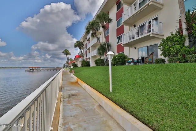 a view of swimming pool with outdoor seating