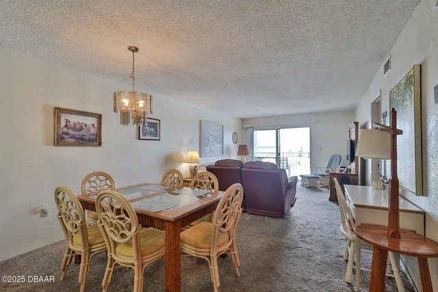 a living room with furniture a rug and a large window