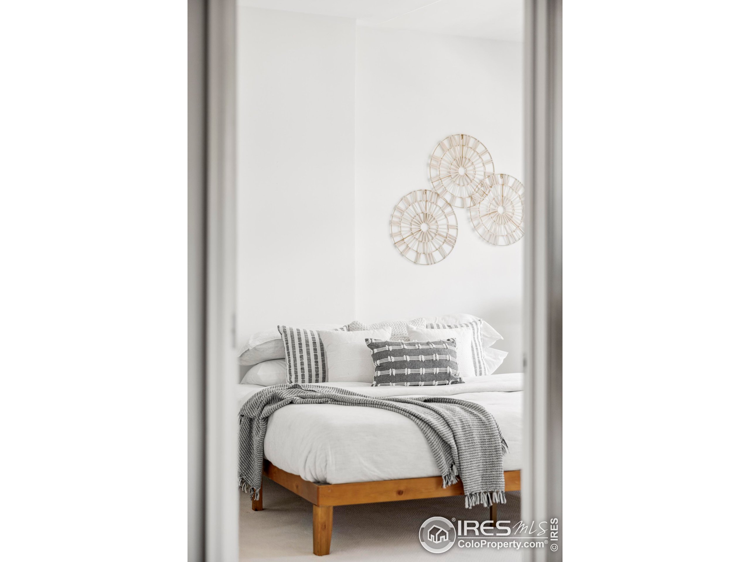 1950 Logan Street, Unit 1013 Denver, CO 80203 - Photo 11 of 23 a bedroom with bed and a window