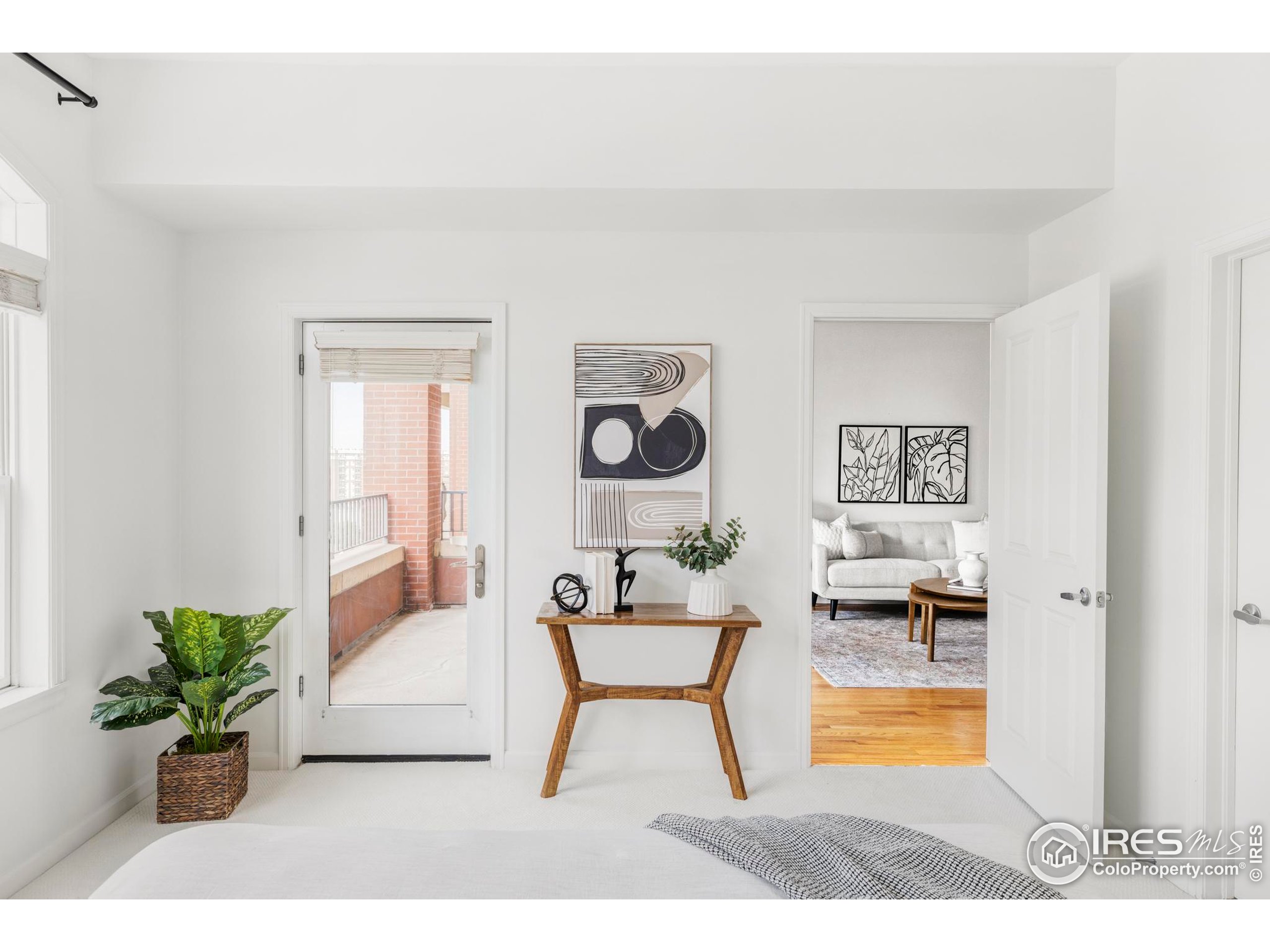 1950 Logan Street, Unit 1013 Denver, CO 80203 - Photo 14 of 23 a living room with furniture and a potted plant