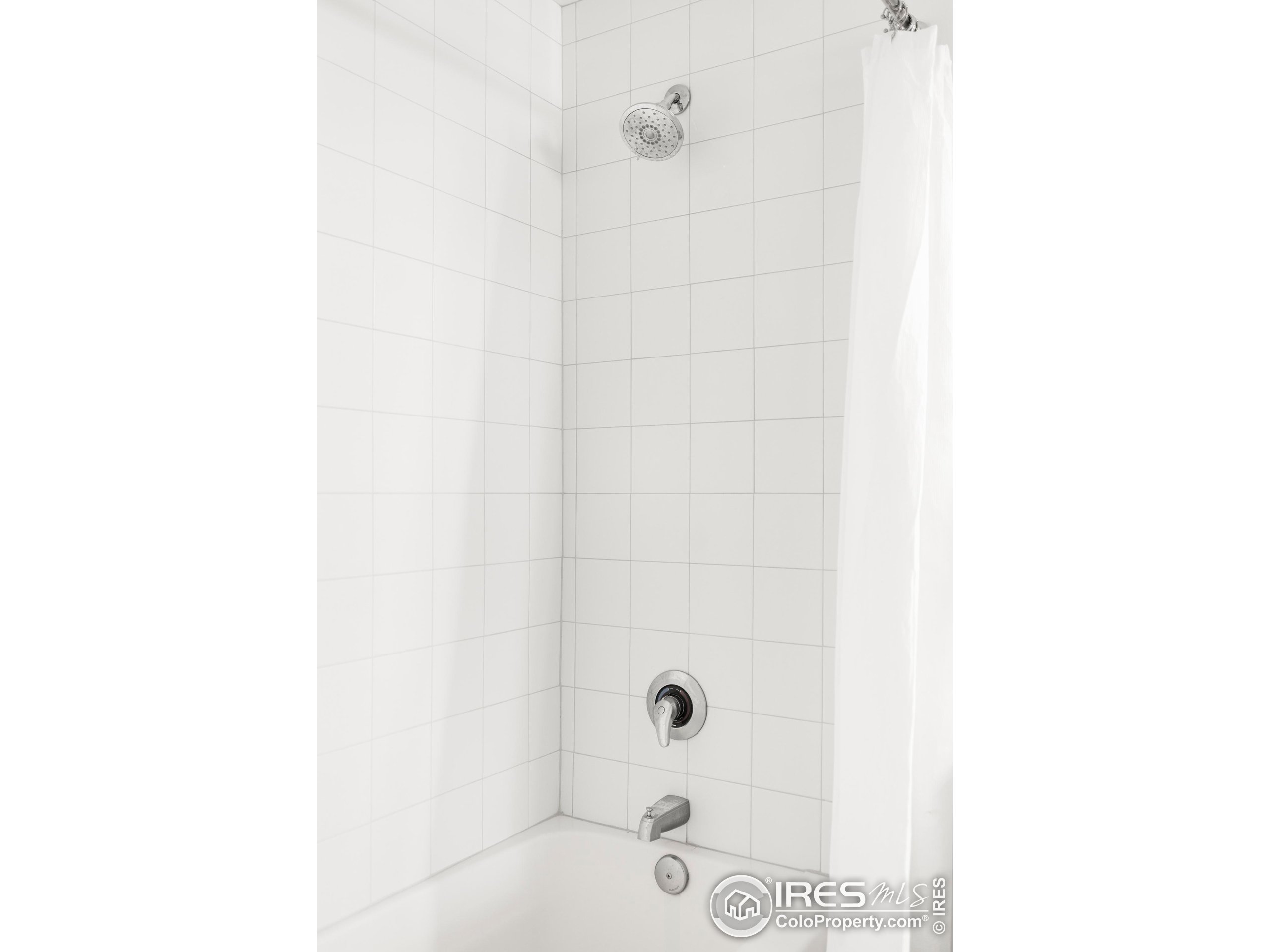 1950 Logan Street, Unit 1013 Denver, CO 80203 - Photo 20 of 23 a bathroom with a shower