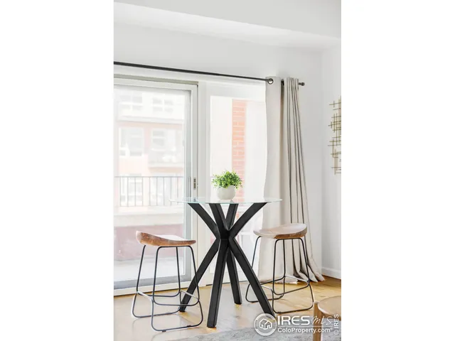 a table and a chair sitting in a room