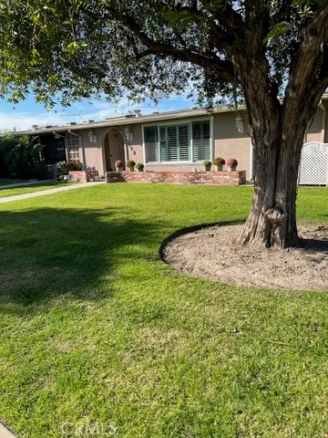 a view of a house with a yard porch and sitting area