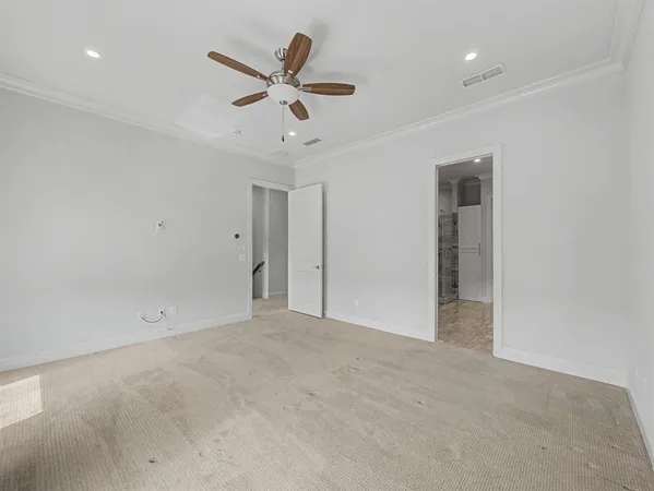 an empty room with a ceiling fan and a ceiling fan