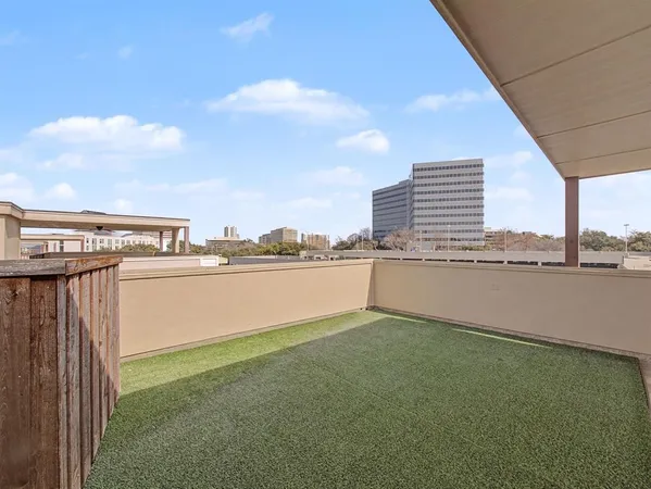 a view of a balcony with chairs