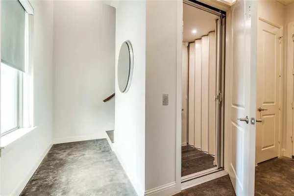 a view of a bathroom from a hallway