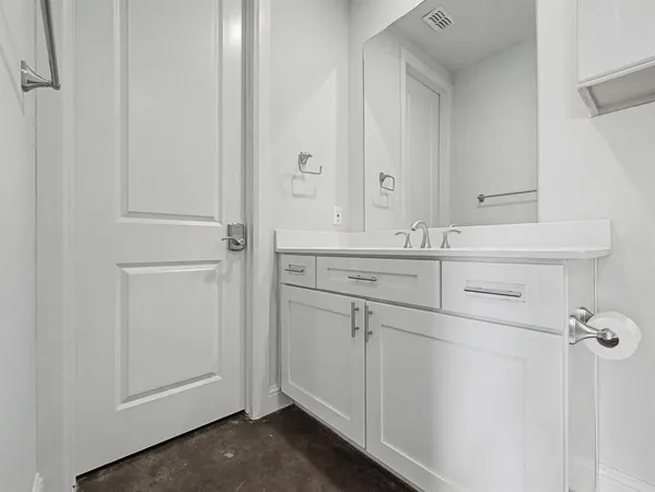 a bathroom with a sink and mirror