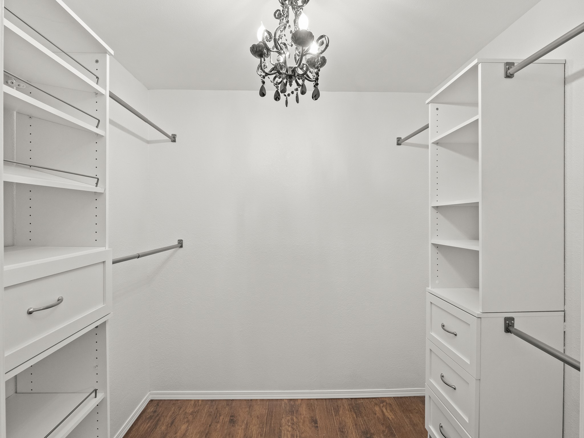 3809 Spicewood Springs Road, Unit 137 Austin, TX 78759 - Photo 14 of 34 Ample shelving and hanging space defines this highly organized walk-in closet.