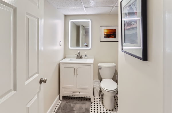 217 Barnes Road Oak Bluffs, MA 02557 - Photo 32 of 60 a bathroom with a toilet sink and mirror
