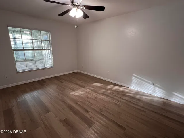 a bathroom with a sink a toilet and shower curtain