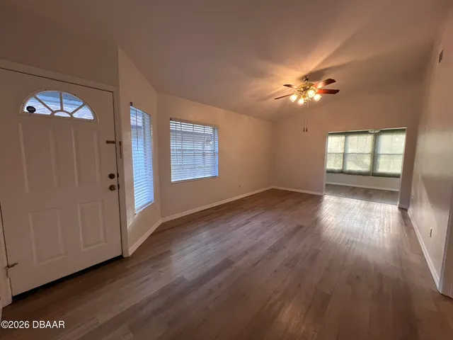 a view of an empty room with a window