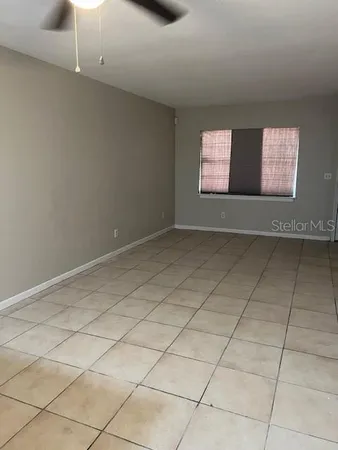 a view of an empty room and window