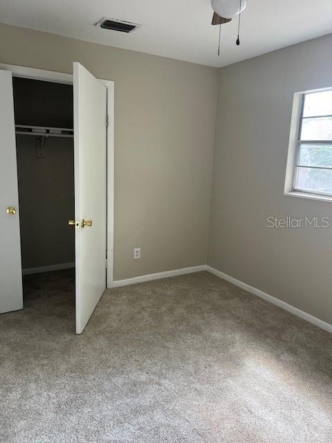 3122 Southwest 26th Terrace, Unit B Gainesville, FL 32608 - Photo 4 of 13 an empty room with closet