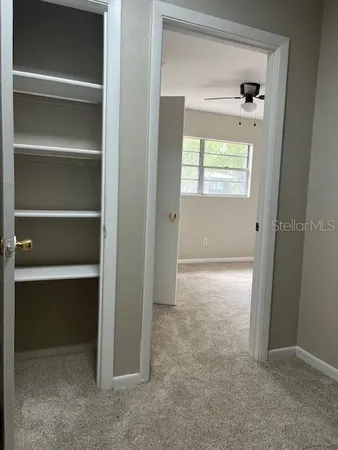 a view of an empty room with a fireplace