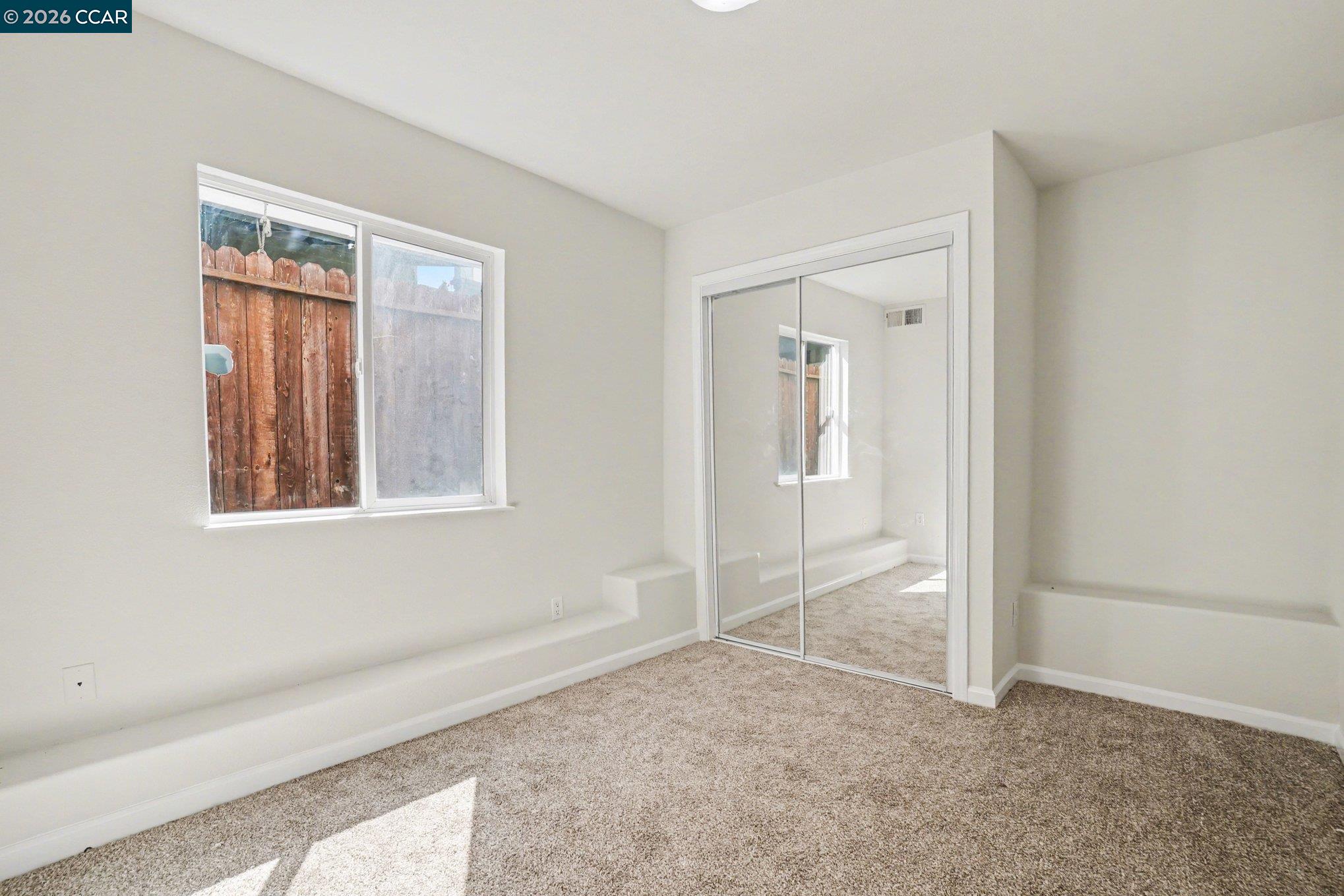 139 Rodeo Avenue Rodeo, CA 94572 - Photo 12 of 19 an empty room with windows and closet