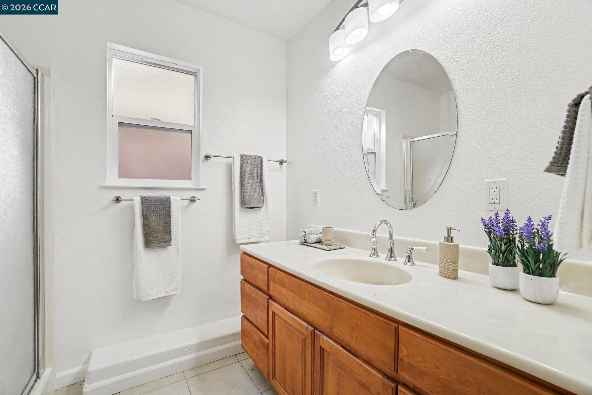 139 Rodeo Avenue Rodeo, CA 94572 - Photo 15 of 19 a bathroom with a sink a vanity and a mirror