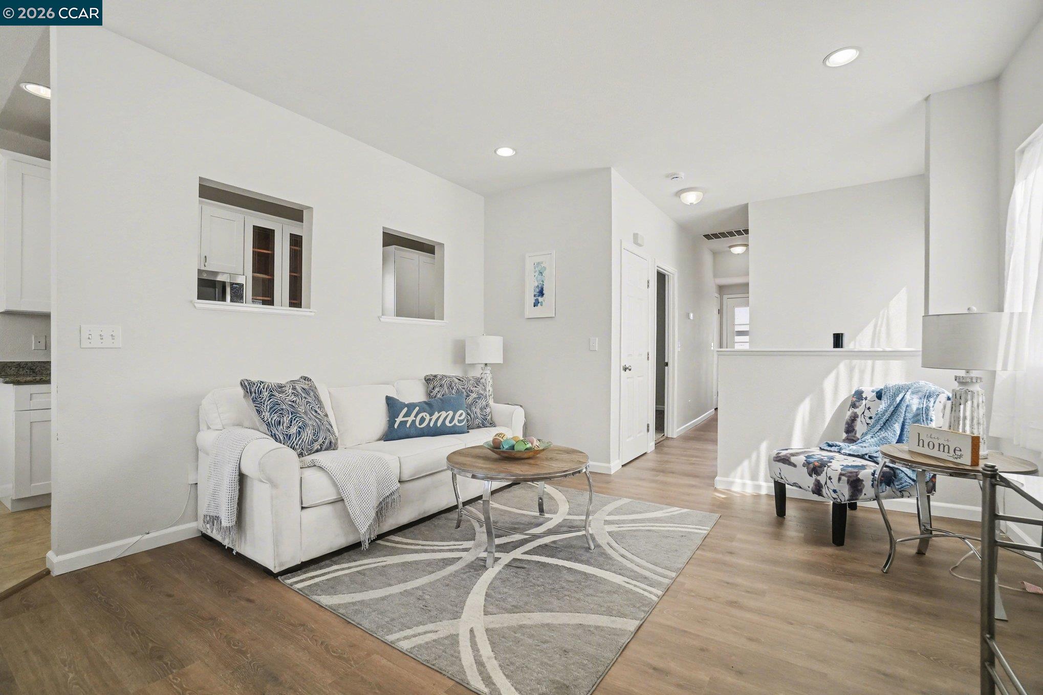 139 Rodeo Avenue Rodeo, CA 94572 - Photo 2 of 19 a living room with furniture and a wooden floor