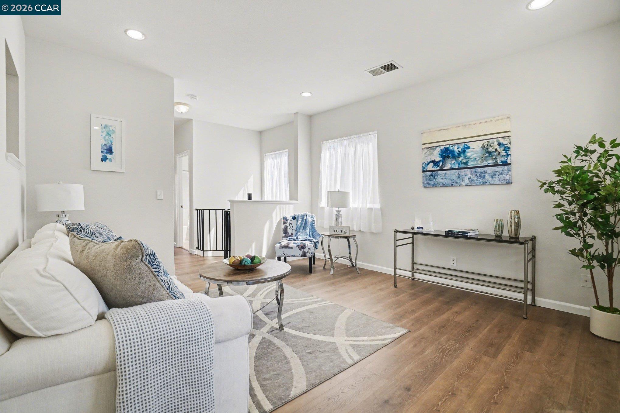 139 Rodeo Avenue Rodeo, CA 94572 - Photo 3 of 19 a living room with furniture and a painting on the wall