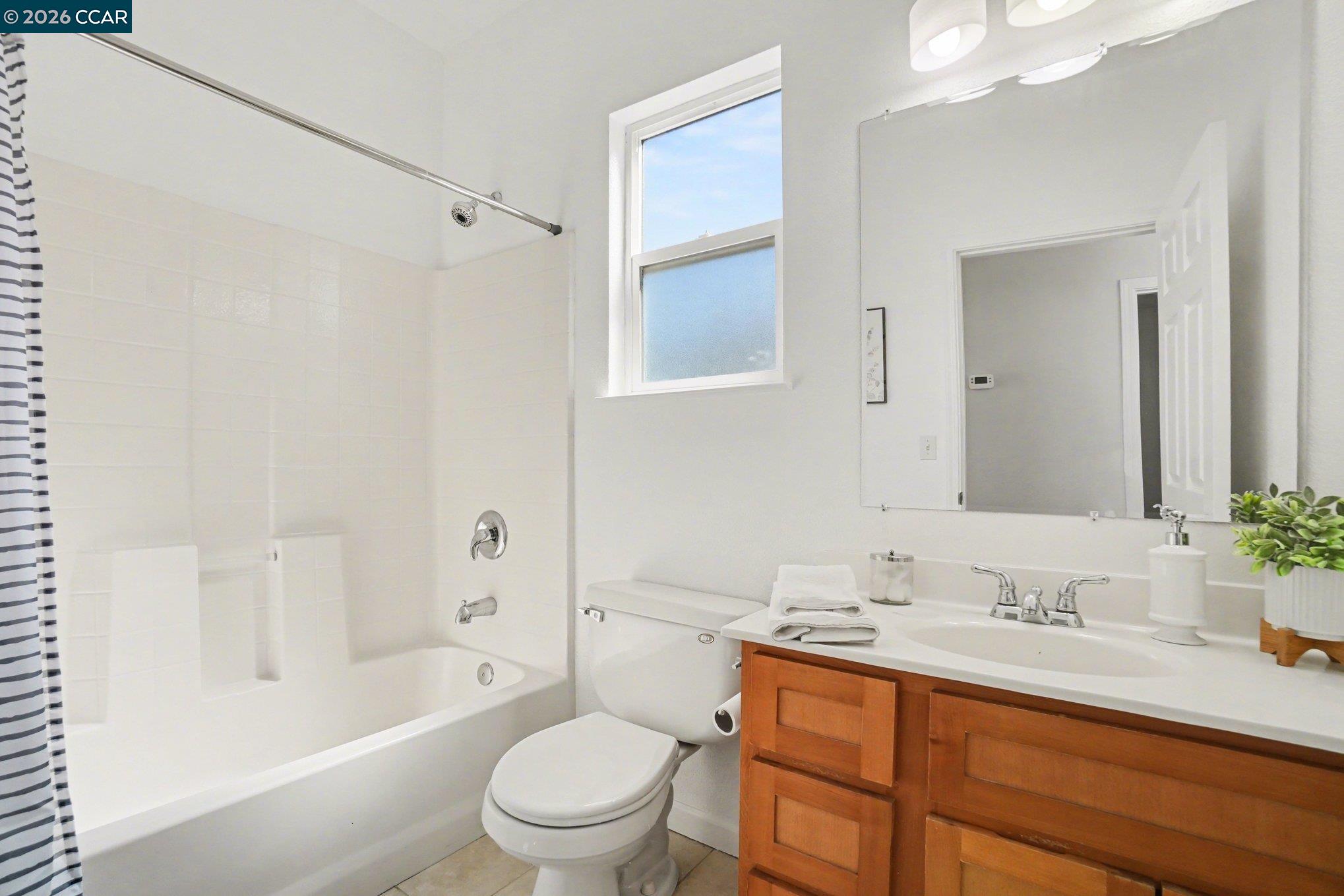 139 Rodeo Avenue Rodeo, CA 94572 - Photo 9 of 19 a bathroom with a granite countertop sink toilet and shower