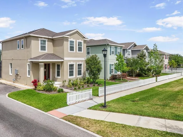 a front view of a house with a yard and porch