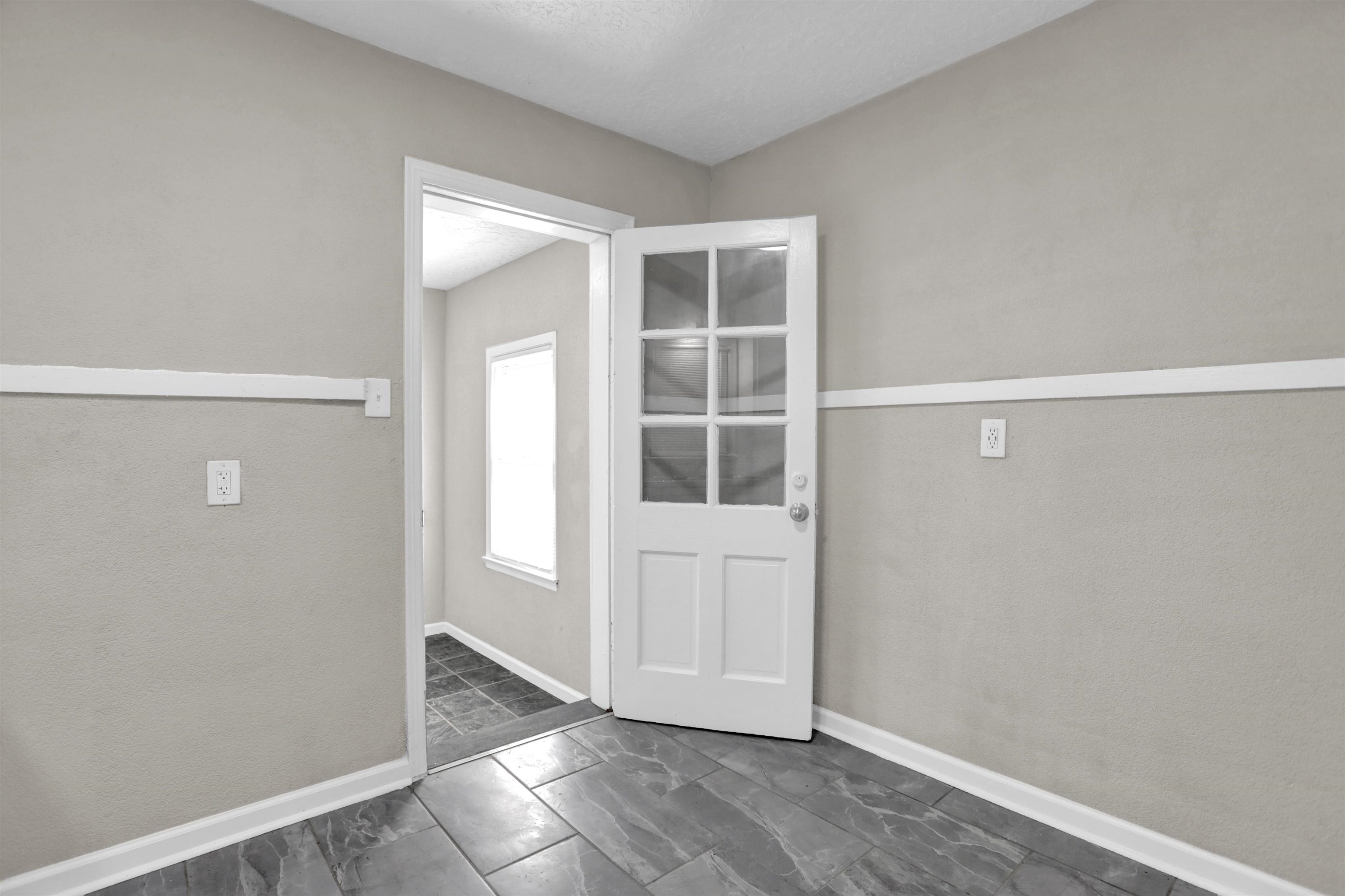 3257 Millington Road Memphis, TN 38127 - Photo 18 of 31 Foyer with baseboards and dark marble finish floors