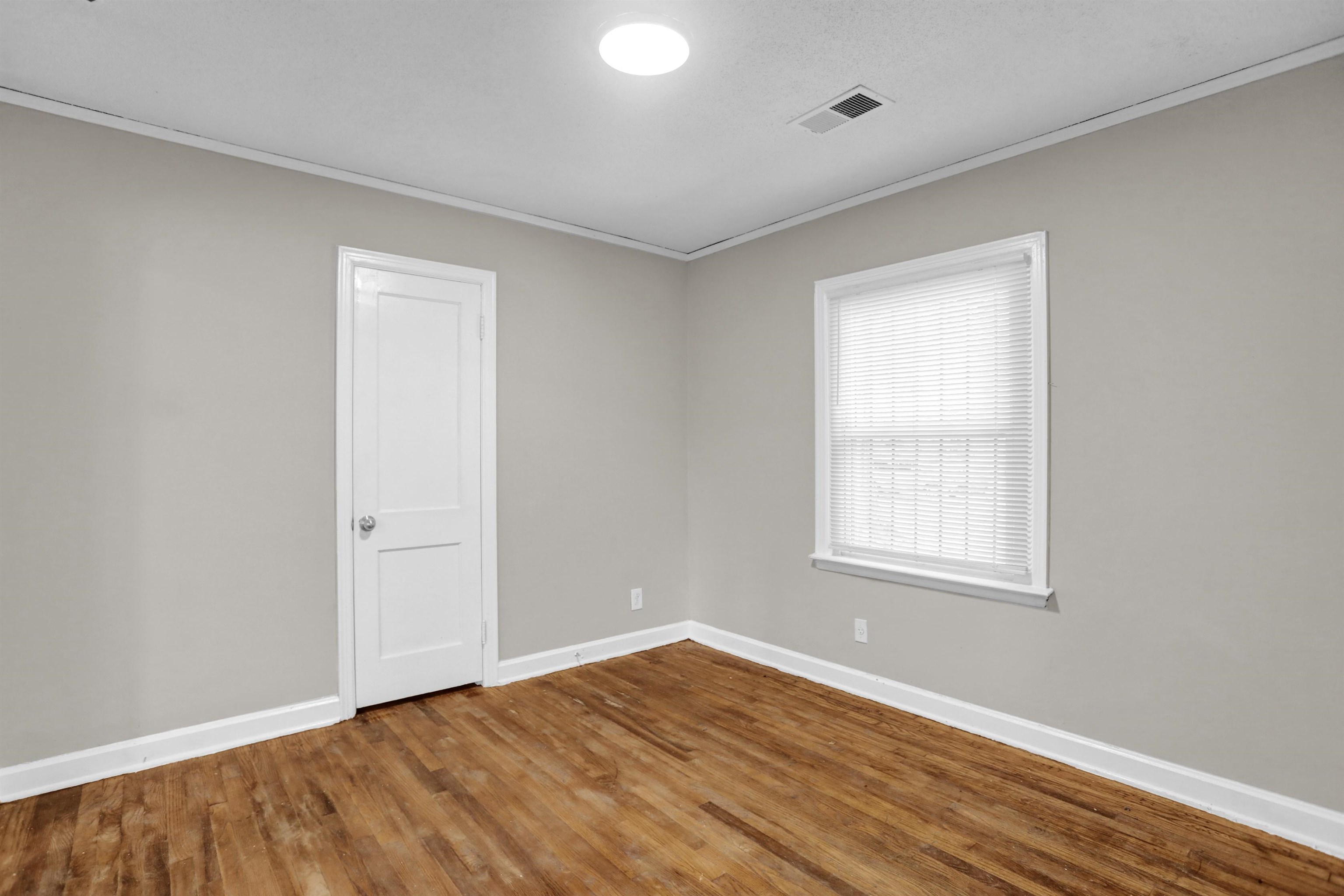 3257 Millington Road Memphis, TN 38127 - Photo 23 of 31 Empty room featuring ornamental molding and wood finished floors