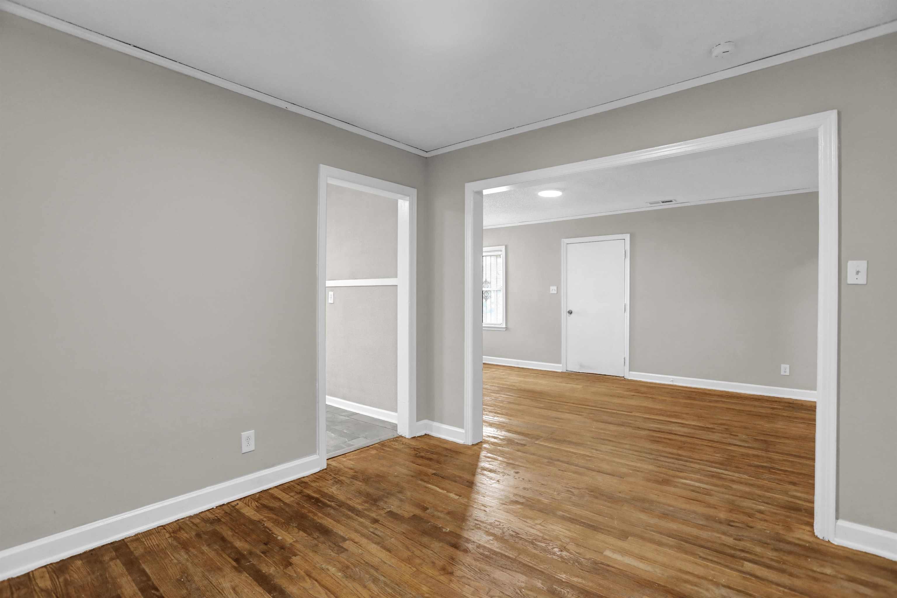 3257 Millington Road Memphis, TN 38127 - Photo 25 of 31 Spare room with crown molding, wood finished floors, and a smoke detector
