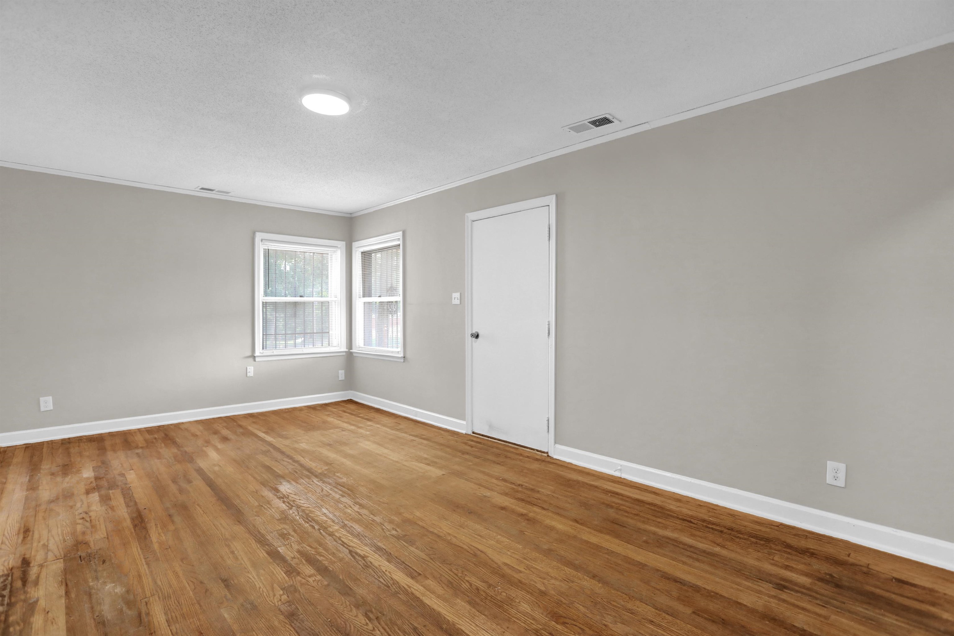 3257 Millington Road Memphis, TN 38127 - Photo 27 of 31 Spare room with ornamental molding, wood finished floors, and a textured ceiling