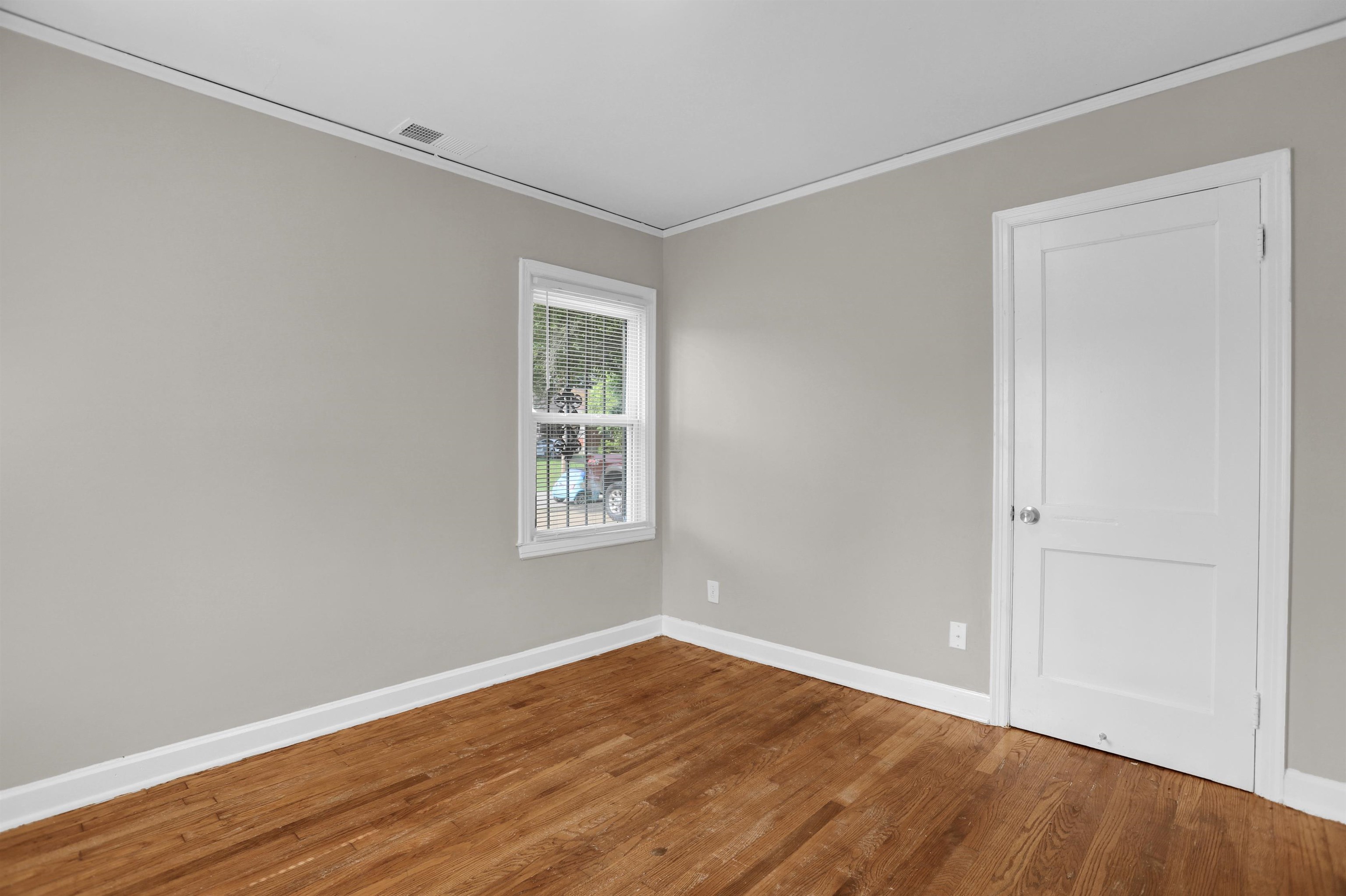 3257 Millington Road Memphis, TN 38127 - Photo 8 of 31 Spare room featuring ornamental molding and wood finished floors