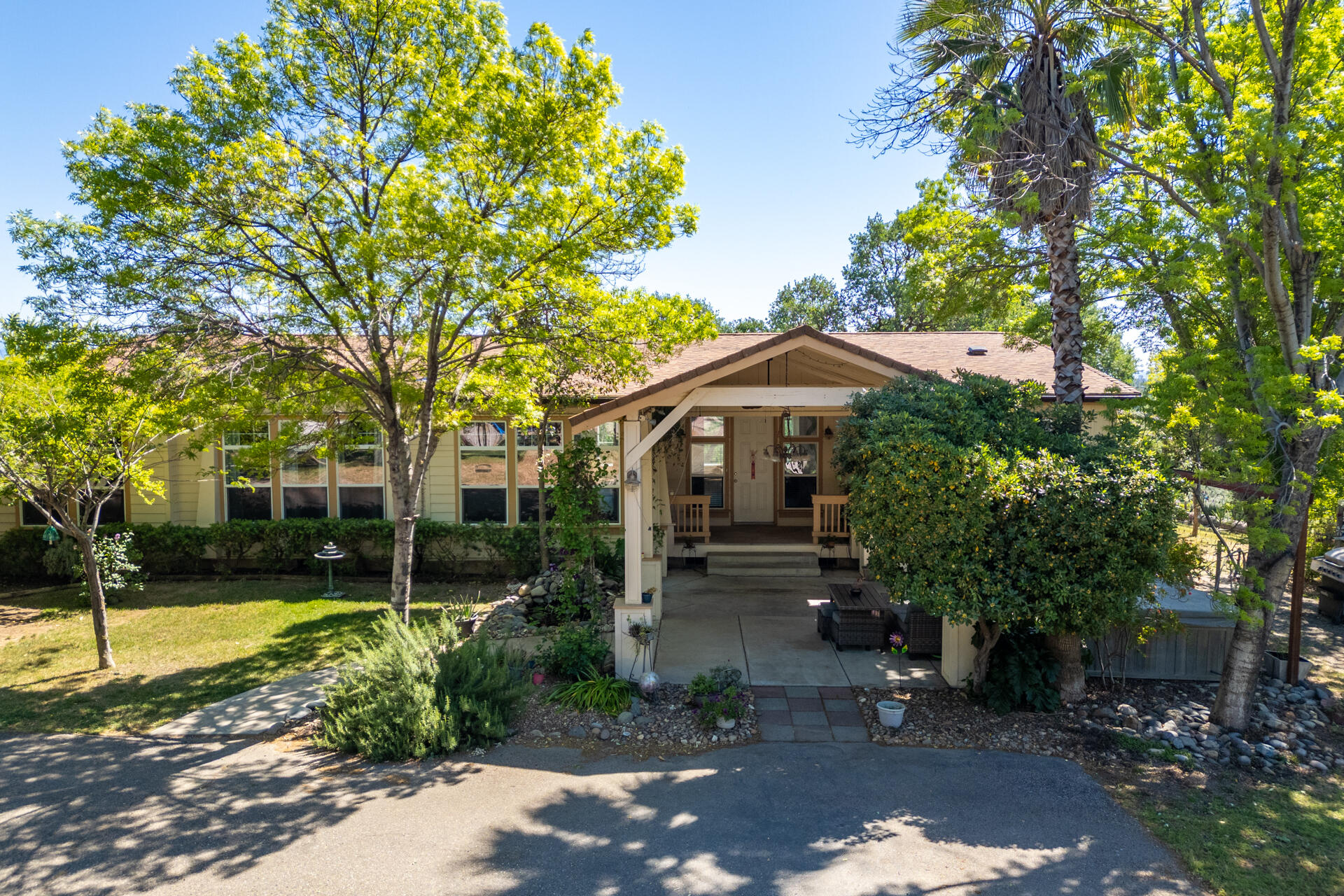 21100 Doe Run Way Red Bluff, CA 96080 - Photo 1 of 93 a front view of a house with a yard