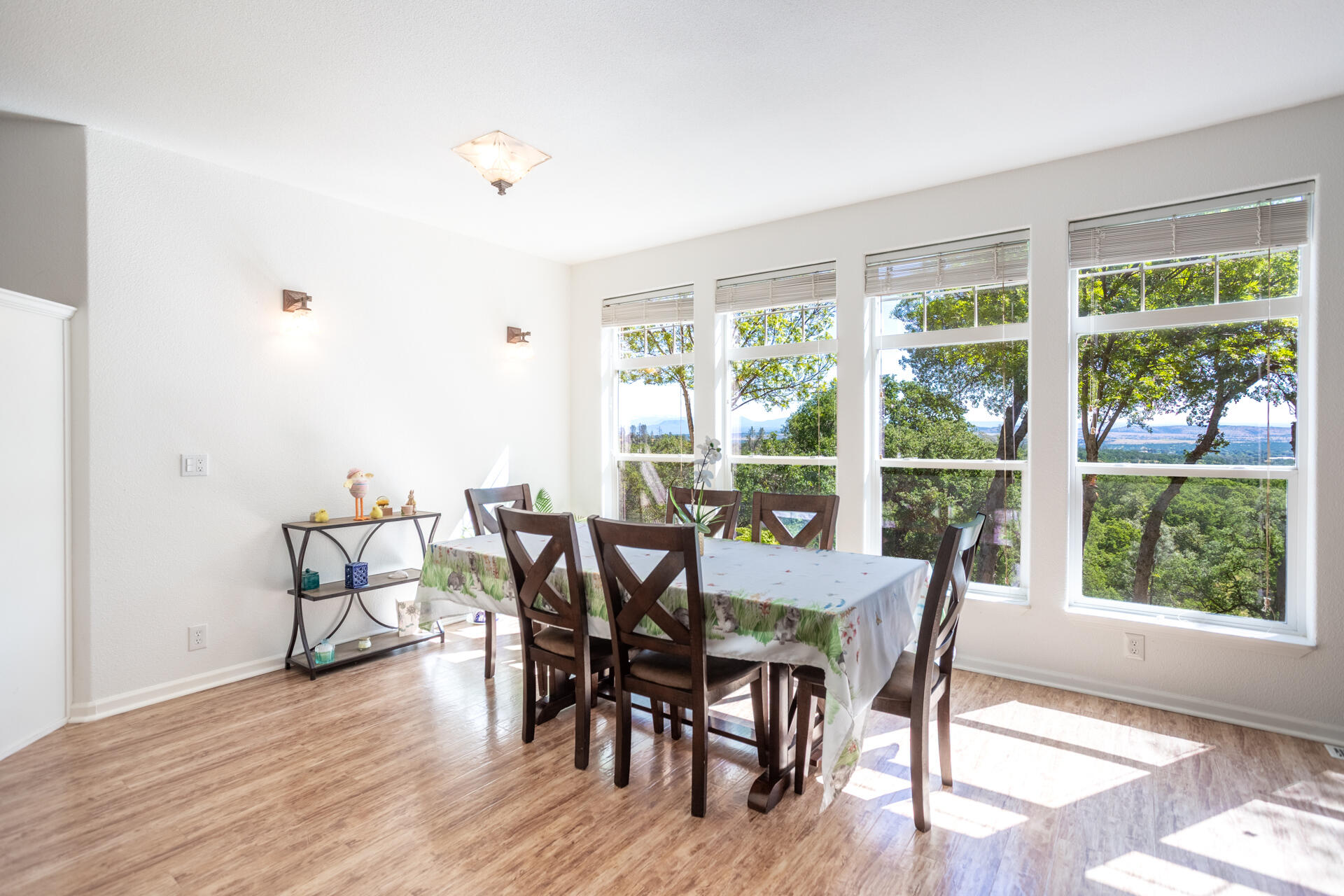 21100 Doe Run Way Red Bluff, CA 96080 - Photo 16 of 93 a view of a dining room with furniture and wooden floor