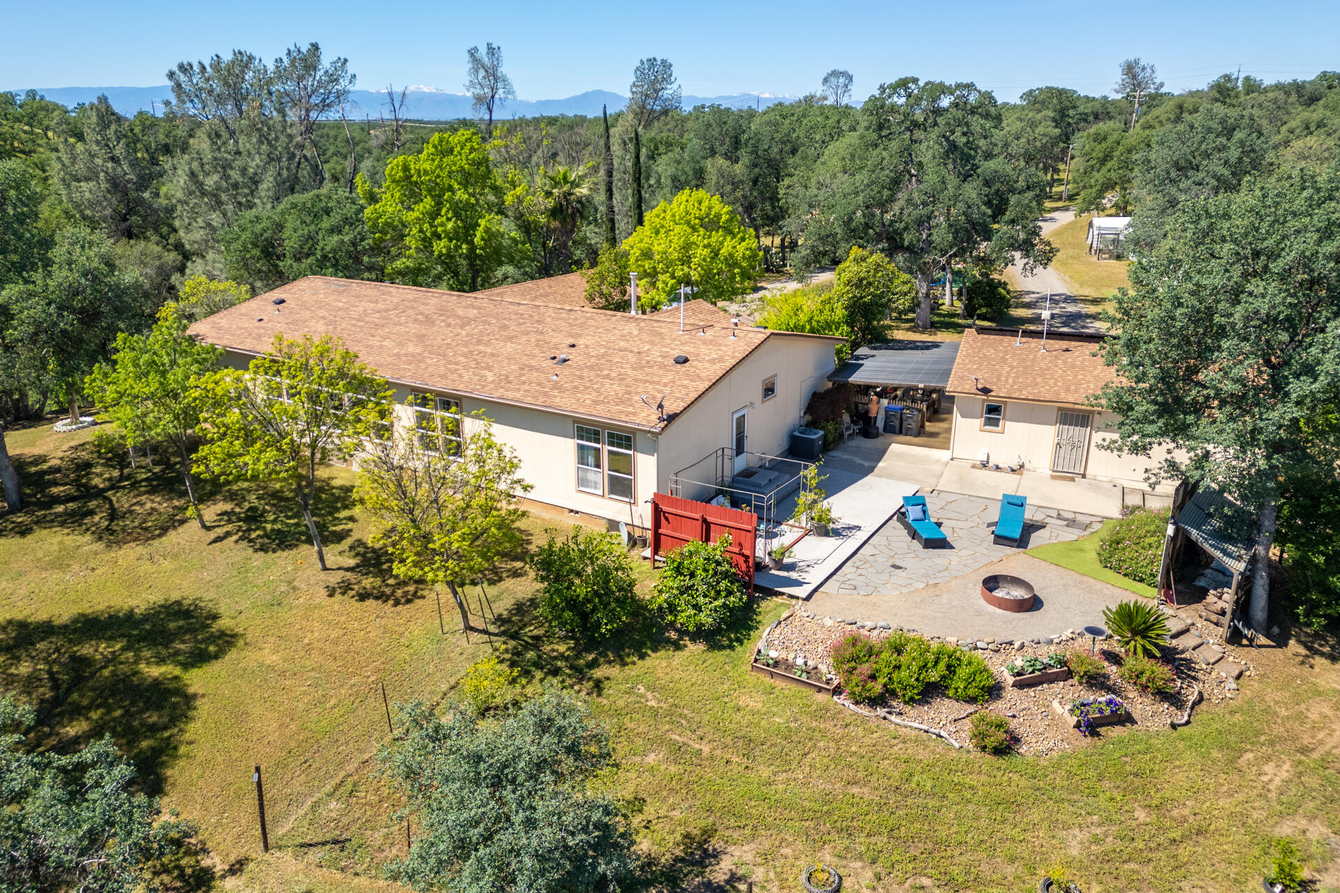 21100 Doe Run Way Red Bluff, CA 96080 - Photo 3 of 93 an aerial view of a house with a yard and lake view