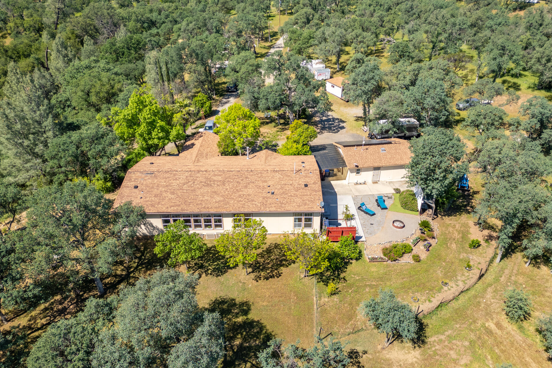 21100 Doe Run Way Red Bluff, CA 96080 - Photo 32 of 93 an aerial view of a house with a yard and lake view